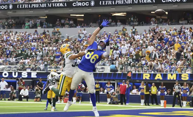 Green Bay Packers safety Evan Williams (33) forces an incompletion against Los Angeles Rams tight end Colby Parkinson (86) during the first half of an NFL football game Sunday, Oct. 6, 2024, in Inglewood, Calif. (AP Photo/Ryan Sun)