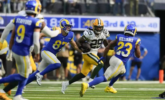 Green Bay Packers safety Xavier McKinney (29) intercepts the ball during the second half of an NFL football game against the Los Angeles Rams Sunday, Oct. 6, 2024, in Inglewood, Calif. (AP Photo/Gregory Bull)