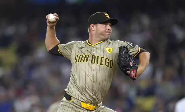 San Diego Padres starting pitcher Michael King throws to the plate during the first inning of a baseball game against the Los Angeles Dodgers, Tuesday, Sept. 24, 2024, in Los Angeles. (AP Photo/Mark J. Terrill)