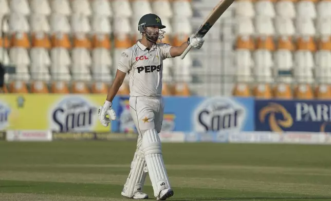 Pakistan's Salman Ali Agha celebrates after scoring fifty during the third day of the second test cricket match between Pakistan and England, in Multan, Pakistan, Thursday, Oct. 17, 2024. (AP Photo/K.M. Chaudary)