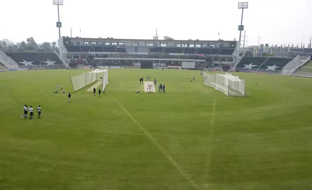 Players of England, left, and Pakistan cricket teams attend practice session, in Rawalpindi, Pakistan, Tuesday, Oct. 22, 2024. (AP Photo/Anjum Naveed)