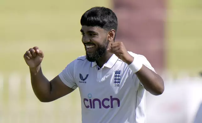 England's Rehan Ahmed celebrates after taking the wicket of Pakistan's Aamer Jamal during the day two of third test cricket match between Pakistan and England, in Rawalpindi, Pakistan, Friday, Oct. 25, 2024. (AP Photo/Anjum Naveed)