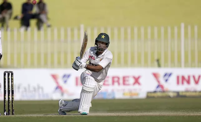 Pakistan's Noman Ali plays a shot during the day two of third test cricket match between Pakistan and England, in Rawalpindi, Pakistan, Friday, Oct. 25, 2024. (AP Photo/Anjum Naveed)