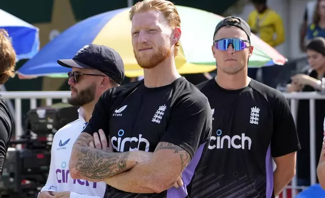 England's Ben Stokes, center, and teammates stand in a awarding ceremony on the end of third test cricket match between Pakistan and England, in Rawalpindi, Pakistan, Saturday, Oct. 26, 2024. (AP Photo/Anjum Naveed)