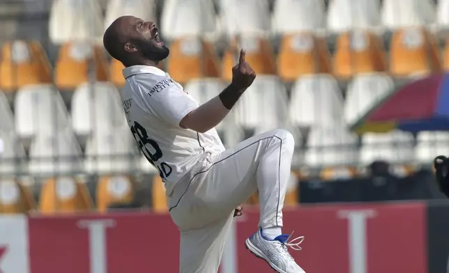 Pakistan's Sajid Khan celebrates after taking the wicket of England's Ollie Pope during the fourth day of the second test cricket match between Pakistan and England, in Multan, Pakistan, Friday, Oct. 18, 2024. (AP Photo/K.M. Chaudary)