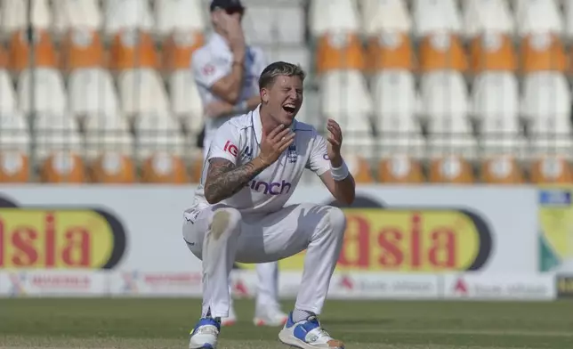 England's Brydon Carse reacts during the third day of the second test cricket match between Pakistan and England, in Multan, Pakistan, Thursday, Oct. 17, 2024. (AP Photo/K.M. Chaudary)