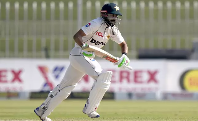 Pakistan's Saud Shakeel runs to take a score during the day two of third test cricket match between Pakistan and England, in Rawalpindi, Pakistan, Friday, Oct. 25, 2024. (AP Photo/Anjum Naveed)