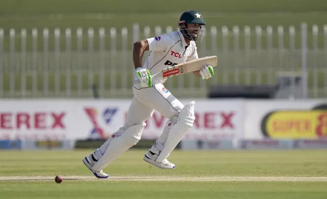 Pakistan's Shan Masood runs to take a score during the day two of third test cricket match between Pakistan and England, in Rawalpindi, Pakistan, Friday, Oct. 25, 2024. (AP Photo/Anjum Naveed)