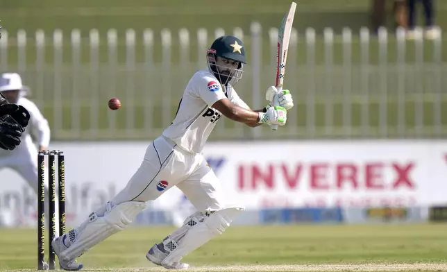 Pakistan's Saud Shakeel plays a shot during the day two of third test cricket match between Pakistan and England, in Rawalpindi, Pakistan, Friday, Oct. 25, 2024. (AP Photo/Anjum Naveed)