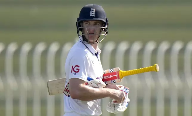 England's Harry Brook reacts as he walks off the field after his dismissal during the day three of third test cricket match between Pakistan and England, in Rawalpindi, Pakistan, Saturday, Oct. 26, 2024. (AP Photo/Anjum Naveed)