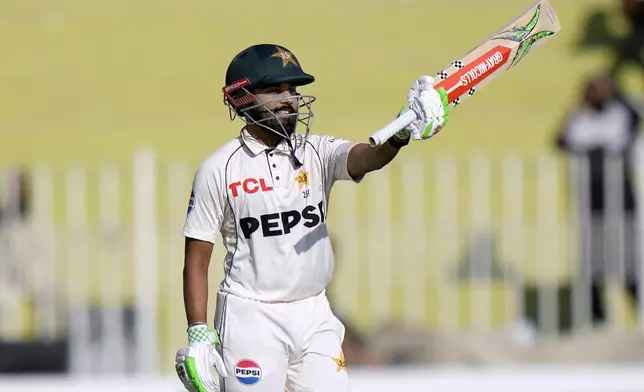 Pakistan's Saud Shakeel celebrates after scoring century during the day two of third test cricket match between Pakistan and England, in Rawalpindi, Pakistan, Friday, Oct. 25, 2024. (AP Photo/Anjum Naveed)