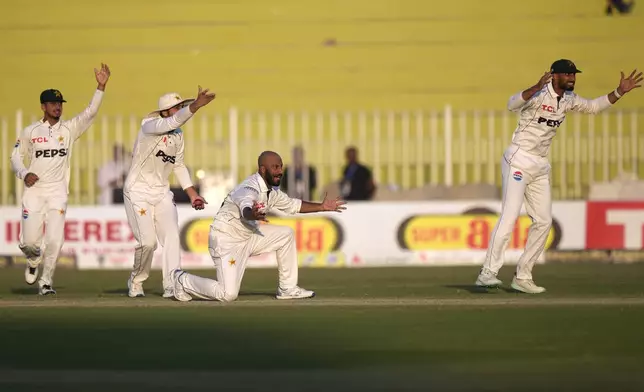 Pakistan's Sajid Khan, center, and teammates appeal successful LBW out of England's Ben Duckett during the day two of third test cricket match between Pakistan and England, in Rawalpindi, Pakistan, Friday, Oct. 25, 2024. (AP Photo/Anjum Naveed)