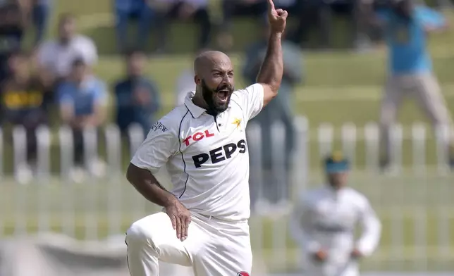 Pakistan's Sajid Khan celebrates after taking the wicket of England's Joe Root during the day one of third test cricket match between Pakistan and England, in Rawalpindi, Pakistan, Thursday, Oct. 24, 2024. (AP Photo/Anjum Naveed)