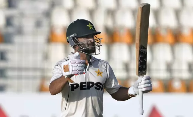 Pakistan's Kamran Ghulam celebrates after scoring century during the first day of the second test cricket match between Pakistan and England, in Multan, Pakistan, Tuesday, Oct. 15, 2024. (AP Photo/K.M. Chaudary)