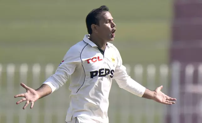 Pakistan's Noman Ali celebrates after taking the wicket of England's Ben Stokes during the day three of third test cricket match between Pakistan and England, in Rawalpindi, Pakistan, Saturday, Oct. 26, 2024. (AP Photo/Anjum Naveed)