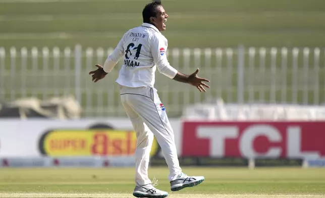 Pakistan's Noman Ali celebrates after taking the wicket of England's Ben Stokes during the day three of third test cricket match between Pakistan and England, in Rawalpindi, Pakistan, Saturday, Oct. 26, 2024. (AP Photo/Anjum Naveed)