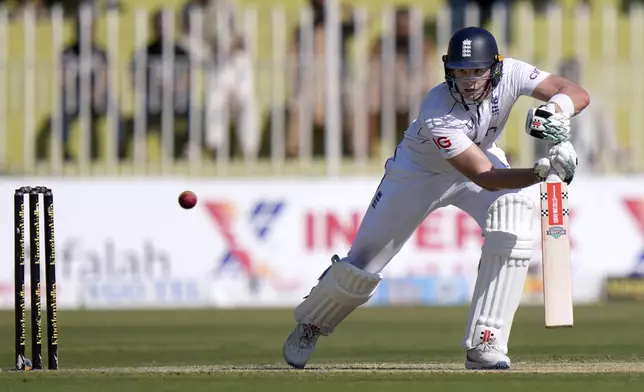 England's Jamie Smith plays a shot during the day one of third test cricket match between Pakistan and England, in Rawalpindi, Pakistan, Thursday, Oct. 24, 2024. (AP Photo/Anjum Naveed)