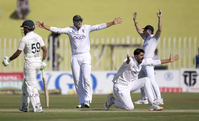 England's Joe Root, second left, Shoaib Bashir and Matthew Potts appeal unsuccessful LBW out of Pakistan's Noman Ali during the day two of third test cricket match between Pakistan and England, in Rawalpindi, Pakistan, Friday, Oct. 25, 2024. (AP Photo/Anjum Naveed)