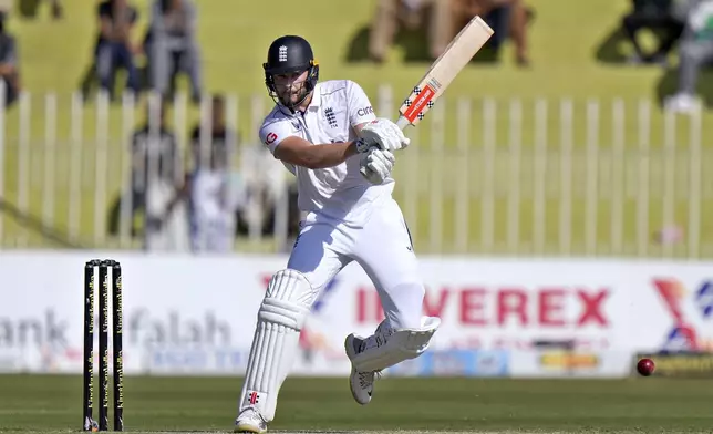 England's Gus Atkinson plays a shot during the day one of third test cricket match between Pakistan and England, in Rawalpindi, Pakistan, Thursday, Oct. 24, 2024. (AP Photo/Anjum Naveed)