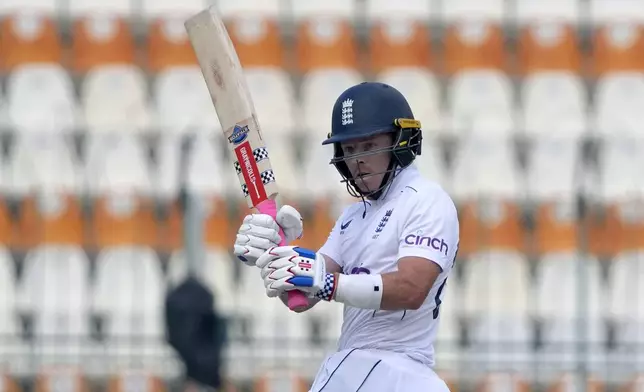 England's Ollie Pope follows the ball after playing a shot during the second day of the second test cricket match between Pakistan and England, in Multan, Pakistan, Wednesday, Oct. 16, 2024. (AP Photo/K.M. Chaudary)