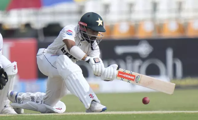 Pakistan's Saud Shakeel plays a shot during the second day of the first test cricket match between Pakistan and England, in Multan, Pakistan, Tuesday, Oct. 8, 2024. (AP Photo/Anjum Naveed)