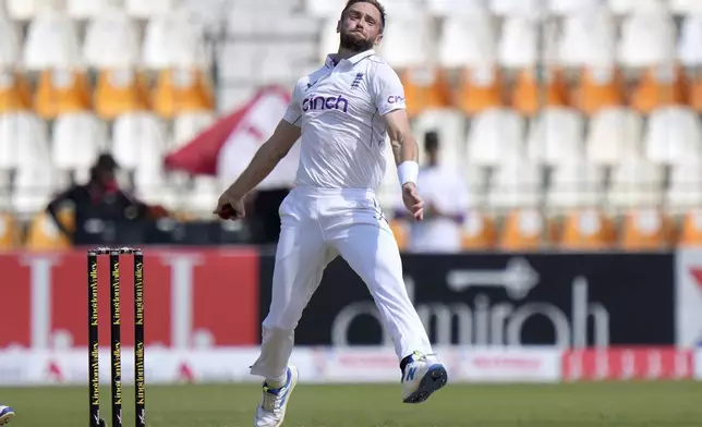 England's Chris Woakes bowls during the first day of the first test cricket match between Pakistan and England, in Multan, Pakistan, Monday, Oct. 7, 2024. (AP Photo/Anjum Naveed)