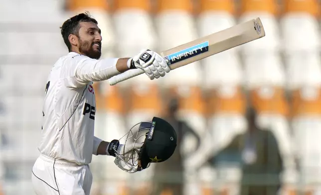 Pakistan's Salman Ali Agha celebrates after scoring century during the second day of the first test cricket match between Pakistan and England, in Multan, Pakistan, Tuesday, Oct. 8, 2024. (AP Photo/Anjum Naveed)