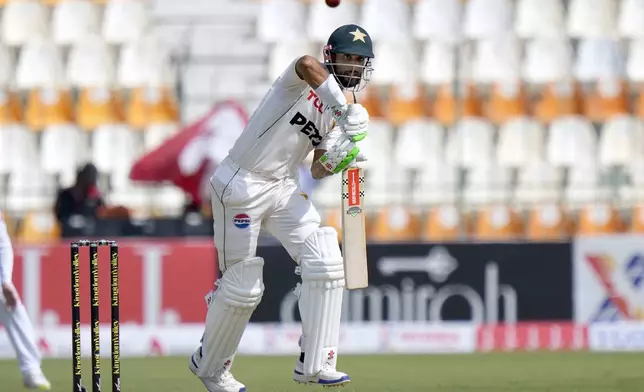 Pakistan's Shan Masood plays a shot during the first day of the first test cricket match between Pakistan and England, in Multan, Pakistan, Monday, Oct. 7, 2024. (AP Photo/Anjum Naveed)