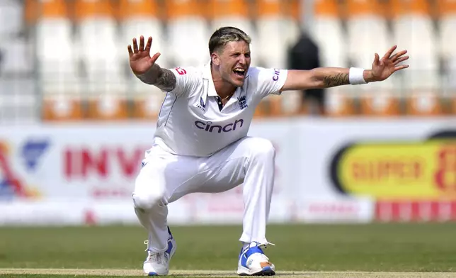 England's Brydon Carse appeals for LBW out of Pakistan's Aamer Jamal during the second day of the first test cricket match between Pakistan and England, in Multan, Pakistan, Tuesday, Oct. 8, 2024. (AP Photo/Anjum Naveed)