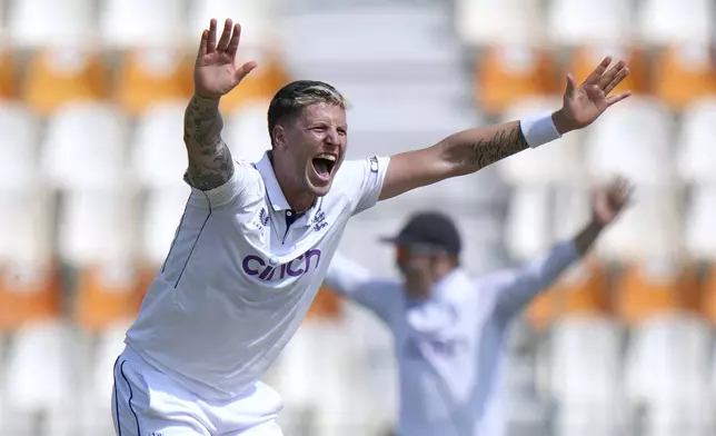 England's Brydon Carse appeals unsuccessfully LBW out of Pakistan's Shan Masood during the first day of the first test cricket match between Pakistan and England, in Multan, Pakistan, Monday, Oct. 7, 2024. (AP Photo/Anjum Naveed)