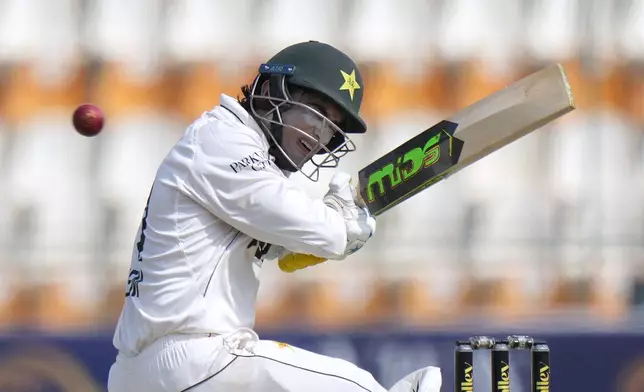 Pakistan's Naseem Shah reacts after a deliver hitting on his shoulder during the second day of the first test cricket match between Pakistan and England, in Multan, Pakistan, Tuesday, Oct. 8, 2024. (AP Photo/Anjum Naveed)