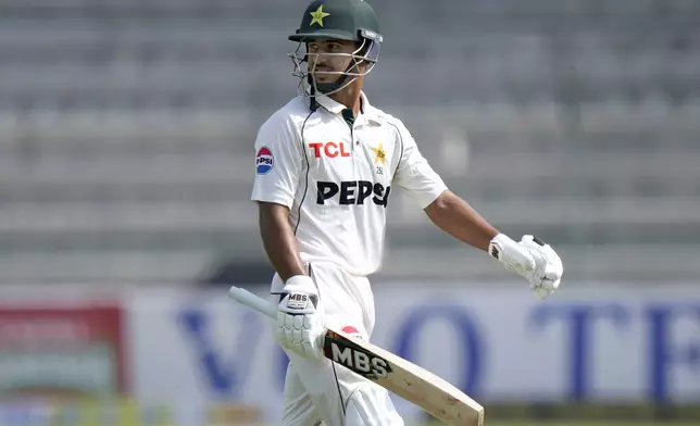 Pakistan's Saim Ayub walks off the field after his dismissal during the first day of the first test cricket match between Pakistan and England, in Multan, Pakistan, Monday, Oct. 7, 2024. (AP Photo/Anjum Naveed)