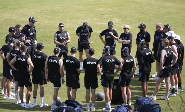 England team's Brendon McCullum, center, in glasses, briefs in a team meeting prior to practice session, in Multan, Pakistan, Saturday, Oct. 5, 2024. (AP Photo/Anjum Naveed)