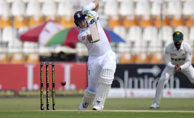 England's Joe Root plays a shot during the third day of the first test cricket match between Pakistan and England, in Multan, Pakistan, Wednesday, Oct. 9, 2024. (AP Photo/Anjum Naveed)