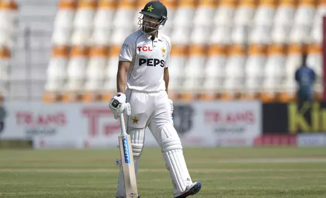 Pakistan's Salman Ali Agha reacts as he walks off the field after his dismissal during the fifth day of the first test cricket match between Pakistan and England, in Multan, Pakistan, Friday, Oct. 11, 2024. (AP Photo/Anjum Naveed)