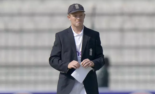 England's Ollie Pope watches after the coin toss before the start of the play of first test cricket match between Pakistan and England, in Multan, Pakistan, Monday, Oct. 7, 2024. (AP Photo/Anjum Naveed)