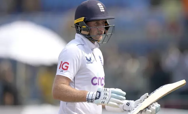 England's Joe Root walks off the field on the lunch break during the third day of the first test cricket match between Pakistan and England, in Multan, Pakistan, Wednesday, Oct. 9, 2024. (AP Photo/Anjum Naveed)