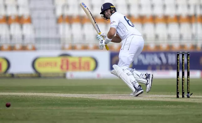 England's Joe Root plays a shot during the third day of the first test cricket match between Pakistan and England, in Multan, Pakistan, Wednesday, Oct. 9, 2024. (AP Photo/Anjum Naveed)