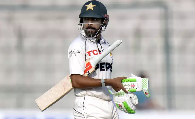 Pakistan's Babar Azam reacts as he walks off the field after his dismissal during the fourth day of the first test cricket match between Pakistan and England, in Multan, Pakistan, Thursday, Oct. 10, 2024. (AP Photo/Anjum Naveed)