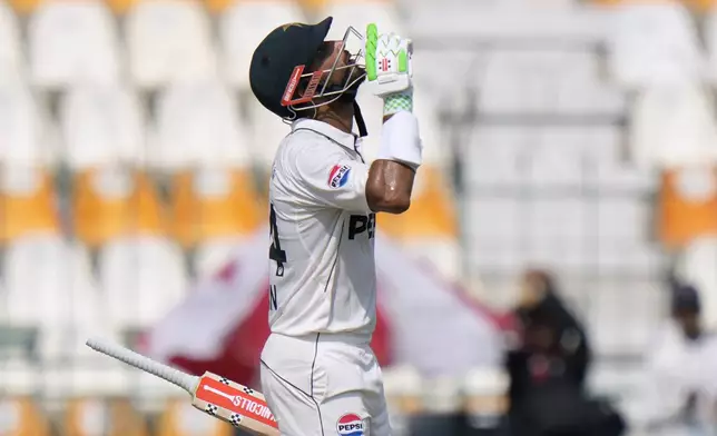 Pakistan's Shan Masood celebrates after scoring century during the first day of the first test cricket match between Pakistan and England, in Multan, Pakistan, Monday, Oct. 7, 2024. (AP Photo/Anjum Naveed)