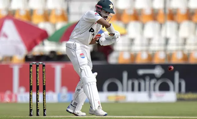 Pakistan's Saud Shakeel plays a shot during the second day of the first test cricket match between Pakistan and England, in Multan, Pakistan, Tuesday, Oct. 8, 2024. (AP Photo/Anjum Naveed)