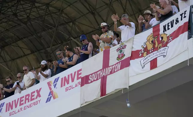 English fans cheer for their team on the end of the first test cricket match between Pakistan and England, in Multan, Pakistan, Friday, Oct. 11, 2024. (AP Photo/Anjum Naveed)