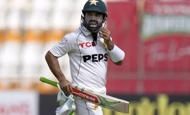 Pakistan's Mohammad Rizwan reacts as he walks off the field after his dismissal during the second day of the first test cricket match between Pakistan and England, in Multan, Pakistan, Tuesday, Oct. 8, 2024. (AP Photo/Anjum Naveed)