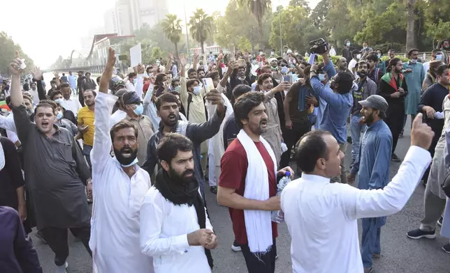 Supporters of imprisoned former Prime Minister Imran Khan's party Pakistan Tehreek-e-Insaf chant slogans and ask for the release of Imran Khan during a protest in Islamabad, Pakistan, Friday, Oct. 4, 2024.(AP Photo/W.K. Yousafzai)