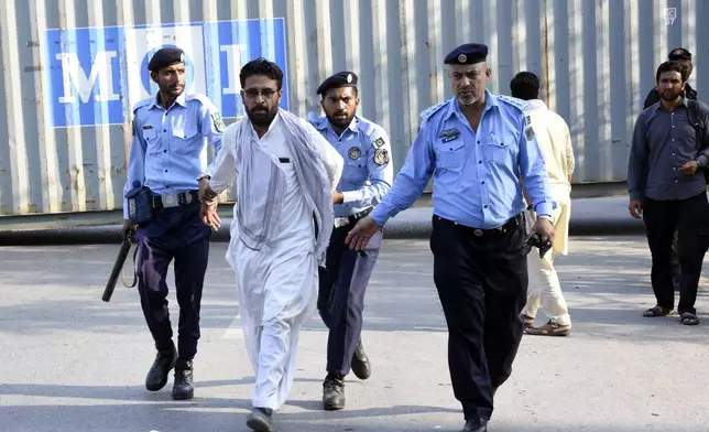 Security personnel detain supporters of imprisoned former Prime Minister Imran Khan's party Pakistan Tehreek-e-Insaf during a protest in Islamabad, Pakistan, Friday, Oct. 4, 2024. (AP Photo/W.K. Yousafzai)