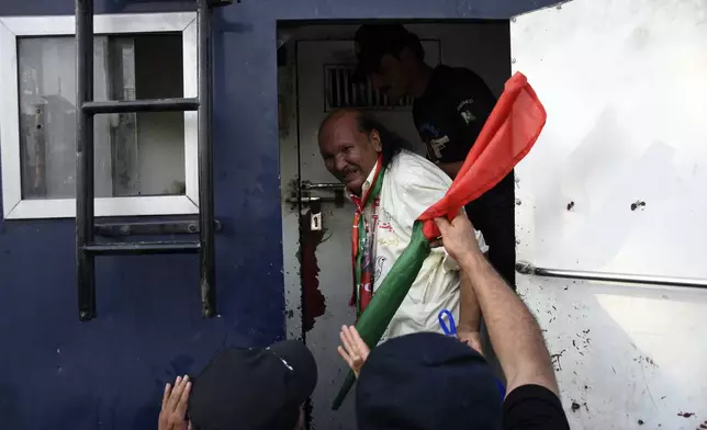 Security personnel detain supporters of imprisoned former Prime Minister Imran Khan's party Pakistan Tehreek-e-Insaf during a protest in Islamabad, Pakistan, Friday, Oct. 4, 2024. (AP Photo/W.K. Yousafzai)