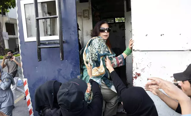 Security personnel detain supporters of imprisoned former Prime Minister Imran Khan's party Pakistan Tehreek-e-Insaf during a protest in Islamabad, Pakistan, Friday, Oct. 4, 2024.(AP Photo/W.K. Yousafzai)