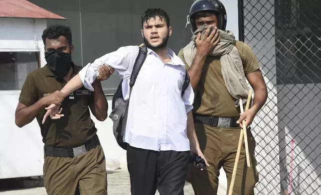 Police officers detain a demonstrator during a students' protest over an alleged on-campus rape in Punjab, in Rawalpindi, Pakistan, Thursday, Oct. 17, 2024. (AP Photo/W.K. Yousafzai)