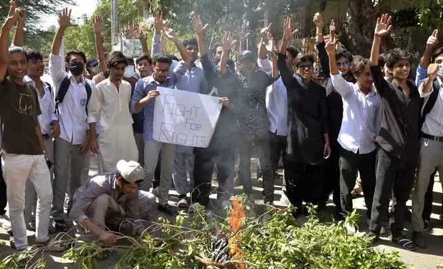 Students burn bushes as they chant slogans over an alleged on-campus rape in Punjab, during a protest in Hyderabad, Pakistan, Thursday, Oct. 17, 2024. (AP Photo/Pervez Mash)