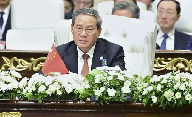 In this photo released by the Press Information Department, China's Premier Li Qiang delivers his speech at the Shanghai Cooperation Organization (SCO) meeting, in Islamabad, Pakistan, Wednesday, Oct. 16, 2024. (Press Information Department via AP)